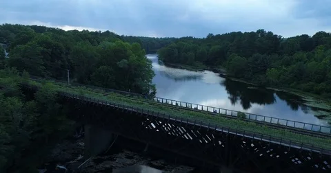 Aerial Over Train Tracks and Calm River Stock Footage 78178761