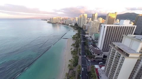 Aerial over Waikiki Beach and hotels and condominiums Stock Footage
