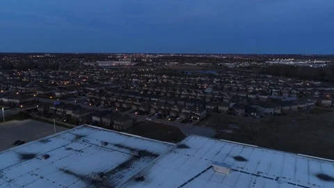 Aerial Over Warehouse Towards Rows Of Houses At Night Stock-Footage 121184178