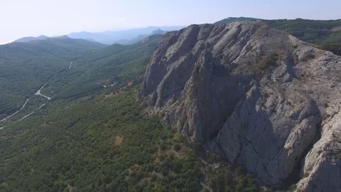 AERIAL Overflight above rocky cliffs Stock Footage 80989798