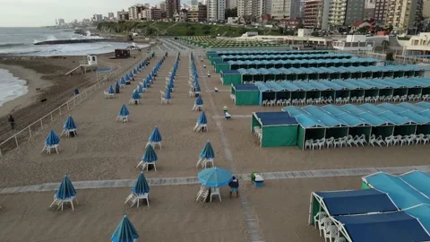 Aerial overflight in empty closed blue beach resort. Tourism crisis. Stock Footage 152956866