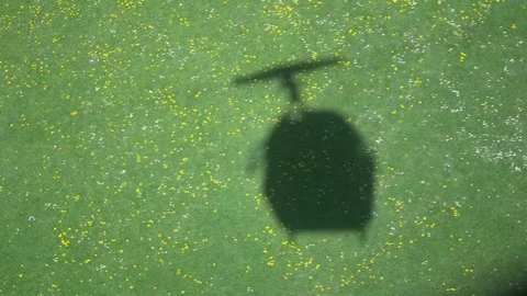Aerial of overhead cable car shadow moving in the field Stock Footage 76046448