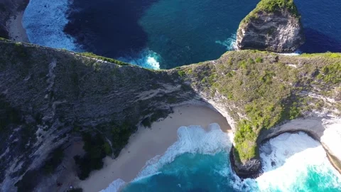 Aerial Overhead Drone View of Kelingking Beach Turquoise Waves Crashing Stock Footage 344880382