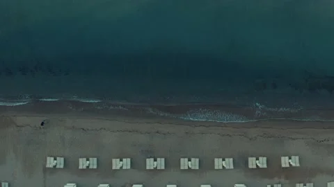 Aerial Overhead Drone View of Lounge Chairs on Sandy Beach Stock Footage 146982631