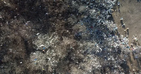 Aerial overhead falling down view on plastic bags and bottles, pollution, trash  Stock Footage 125538772