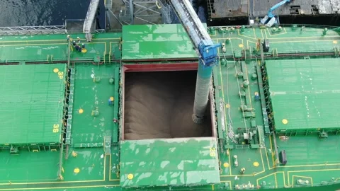 Aerial: Overhead loading pellets into the cargo hold Stock Footage 150121985