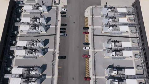 Aerial overhead shot of data center buildings, AI with cooling and power systems Stock-Footage 336519555
