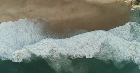 Aerial overhead shot of waves breaking on Atlantic coast Stock Footage 122983089