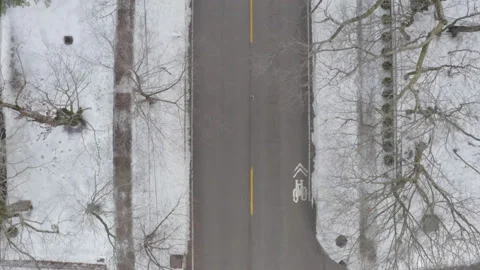Aerial Overhead straight down view of snowy Chicago neighborhood road Stock Footage 211224030