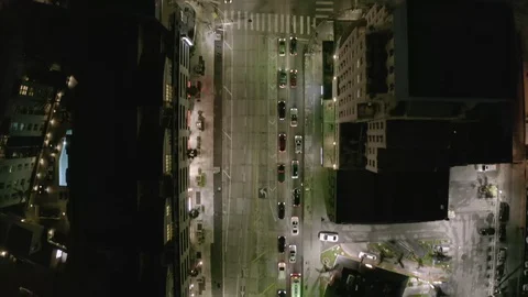 AERIAL: Overhead View of Cinematic Street at Night in Los Angeles with Car Stock Footage