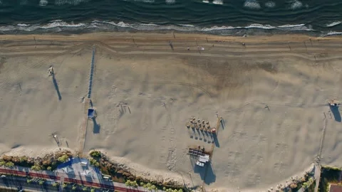 Aerial Overhead View of Sandy Beach and Ocean Waves Stock Footage 344529424