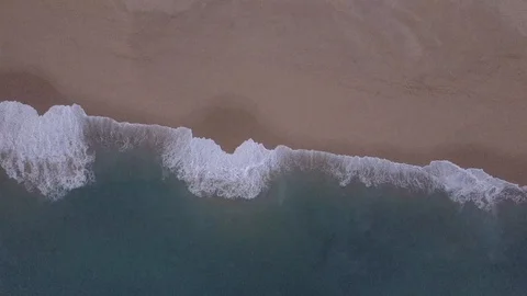 Aerial Overhead of Waves Hitting the Beach Stock Footage 93753322