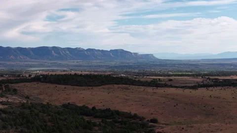 Aerial overlooking Mesa Verde valley and prairie near Dolores Colorado Stock Footage 342474006