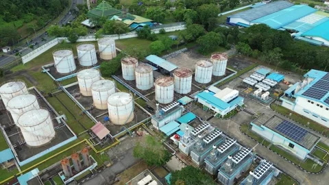 Aerial overview of a large industrial complex, showing storage tanks and ro.. Stock Footage 335192103