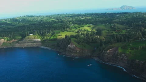 Aerial overview of stunning steep cliffs dropping off into deep blue water Stock Footage 282518987