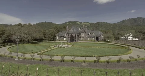 Aerial pan and drop in on fountain and winery. Stock Footage