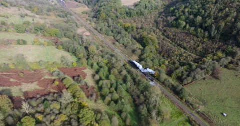 Aerial pan around a steam train, North Yorkshire, England. Stock Footage 292532362