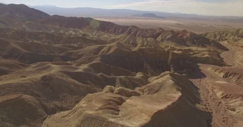 Aerial pan-down over the desert Stock Footage 81047055