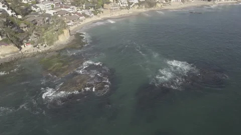 Aerial pan down over the shore at Victoria Beach Stock Footage 157131870