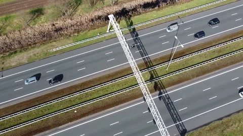 Aerial pan down on three lane major highway Stock Footage 152080031