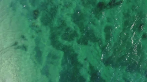 Aerial Pan down of the water changing color in the summer Stock Footage 157234343