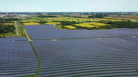 Aerial pan of a large array of solar panels 4K Stock Footage 169712941