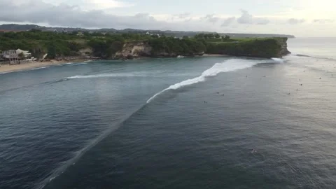 Aerial pan left over cliffs at Balangan Beach, Bali Video stock 329004063
