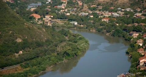 Aerial pan of Mtskheta, eastern Georgia (country).  Mtskheta, eastern Georgia Stock Footage 104254350