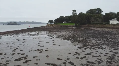 Aerial pan over low tide coast in England Video stock 122215898