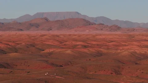 Aerial pan over Namibia desert plains toward Brandberg massif Stock Footage 341427670