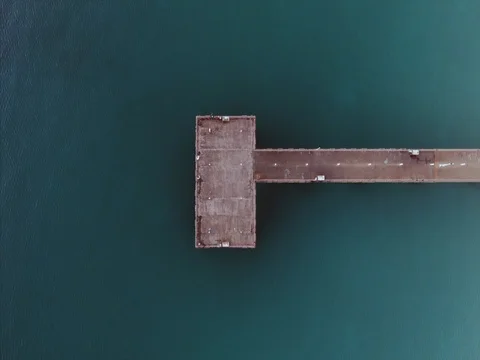 Aerial pan over pier at beach Stock Footage 72322474