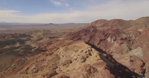 Aerial pan over red colored desert Stock Footage 81047028