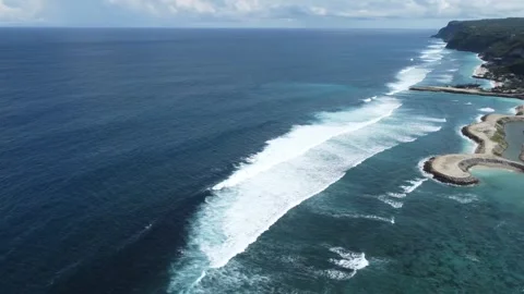 Aerial pan right from ocean to cliffs, Green Bowl Stock Footage 329133892