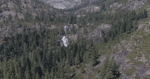 Aerial Pan Right of Waterfall to Forest To Lake Stock Footage 79235325