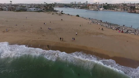 Aerial pan of shore break waves crashing Stock Footage 157130862