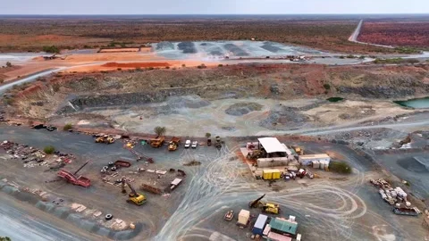 Aerial pan shot of a mining site at Port Headland in Australia with work going Vídeo Stock 309280132