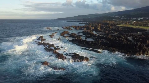 Aerial Pan Shot Of Waves Breaking On Biscoitos Volcanic Rock Coast Azores Stock Footage 90960137