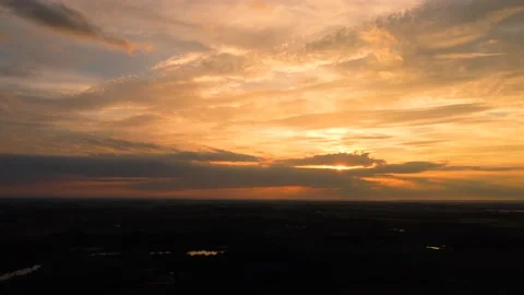 Aerial pan of sunset over open farmland Stock Footage 176581563