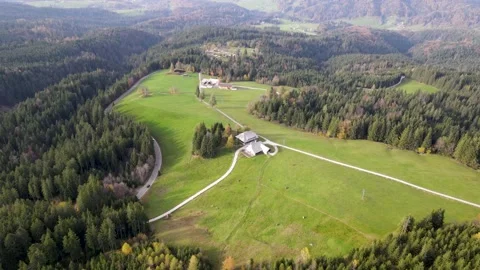 Aerial pan towards rustic barn in the Alps Stock Footage 232767718
