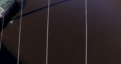 Aerial paning close over cables of Gateshead Millenium Bridge Stock Footage 159152523