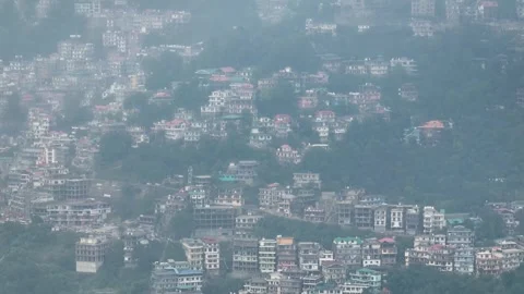 Aerial Panning Down View of Densely Packed Houses and Hotels on Shimla Hills Video stock 333062823