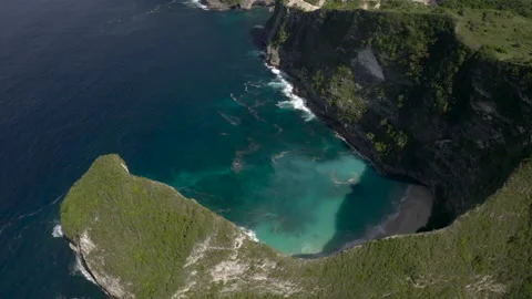 Aerial: Panning High Over Steep Cliff and Tropical Ocean Cove - Nusa Penida &amp; Lo Stock Footage 149648050