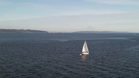 Aerial Panning Medium-close Shot Past Sailboat with Mt Rainier in background Stock Footage 225598517