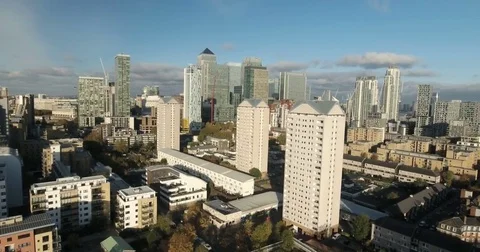 Aerial panning push in view of the financial district of the Docklands in London Stock Footage 70022178