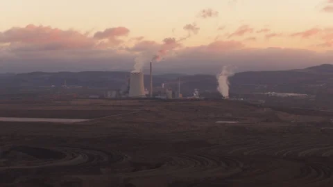 Aerial panning shot of an active coal power plant at sunset Stock Footage 325211532