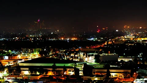 Aerial Panning Shot Of Fireworks Exploding Over Residential Buildings, Drone Stock Footage 243880769