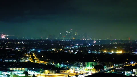 Aerial Panning Shot Of Fireworks Exploding In Modern City, Drone Panning At Stock Footage 255403780