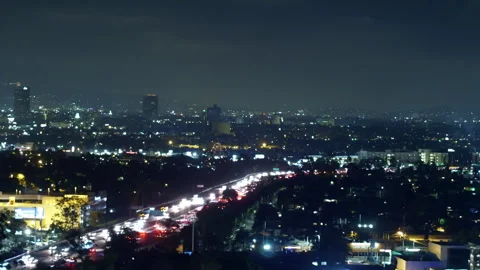 Aerial Panning Shot Of Fireworks Exploding In Residential Modern City At Night - Stock Footage 264045611