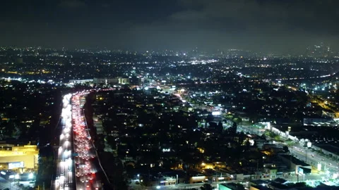 Aerial Panning Shot Of Fireworks Exploding In Illuminated City At Night - Los Stock Footage 264045892