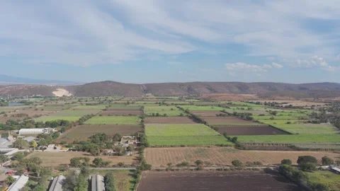 Aerial panning shot over fields in Yautepec during daytime Video stock 328263557